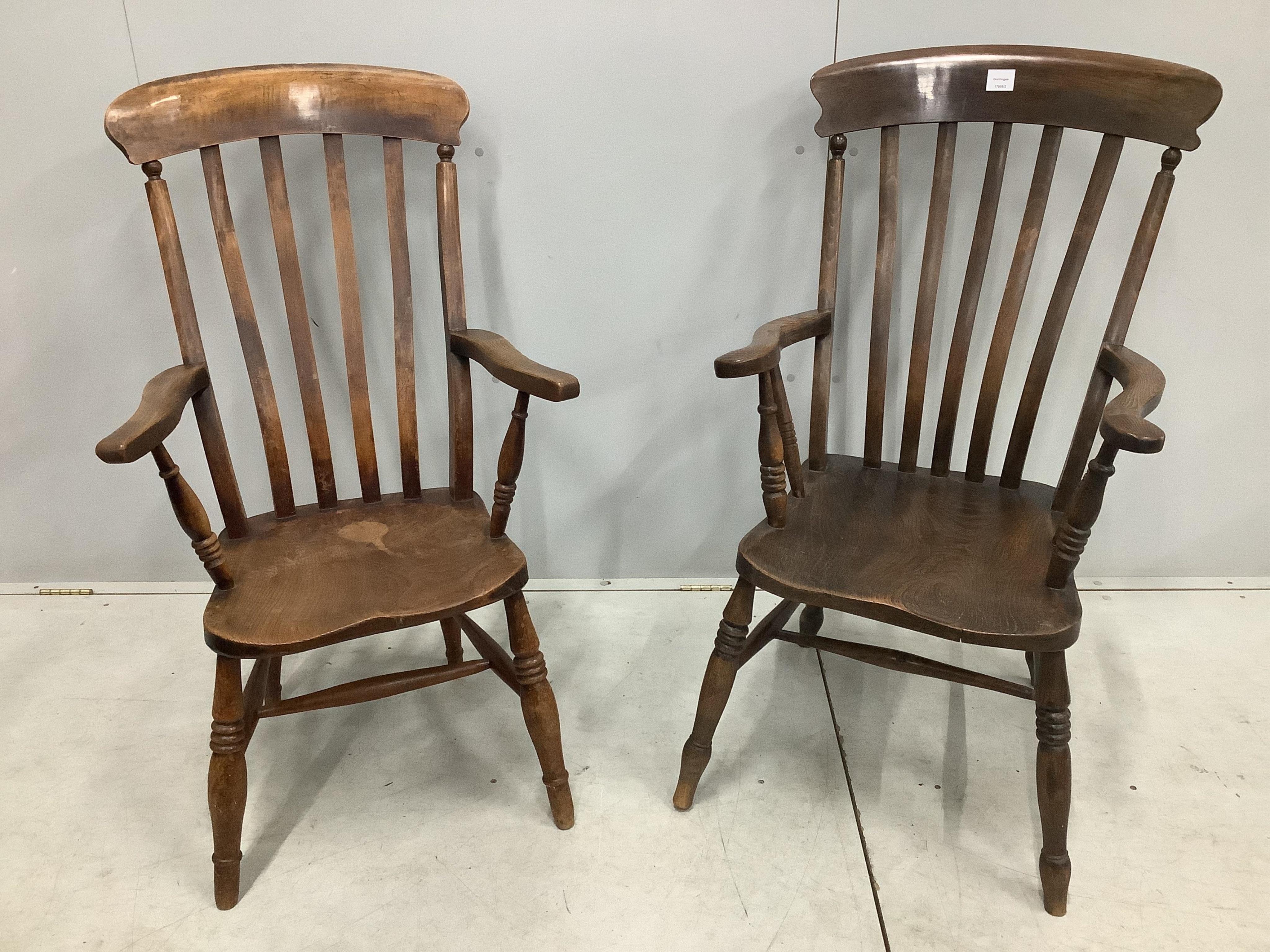 Two 19th century Windsor elm and beech lathe back armchairs, larger width 58cm, depth 48cm, height 110cm. Condition - fair